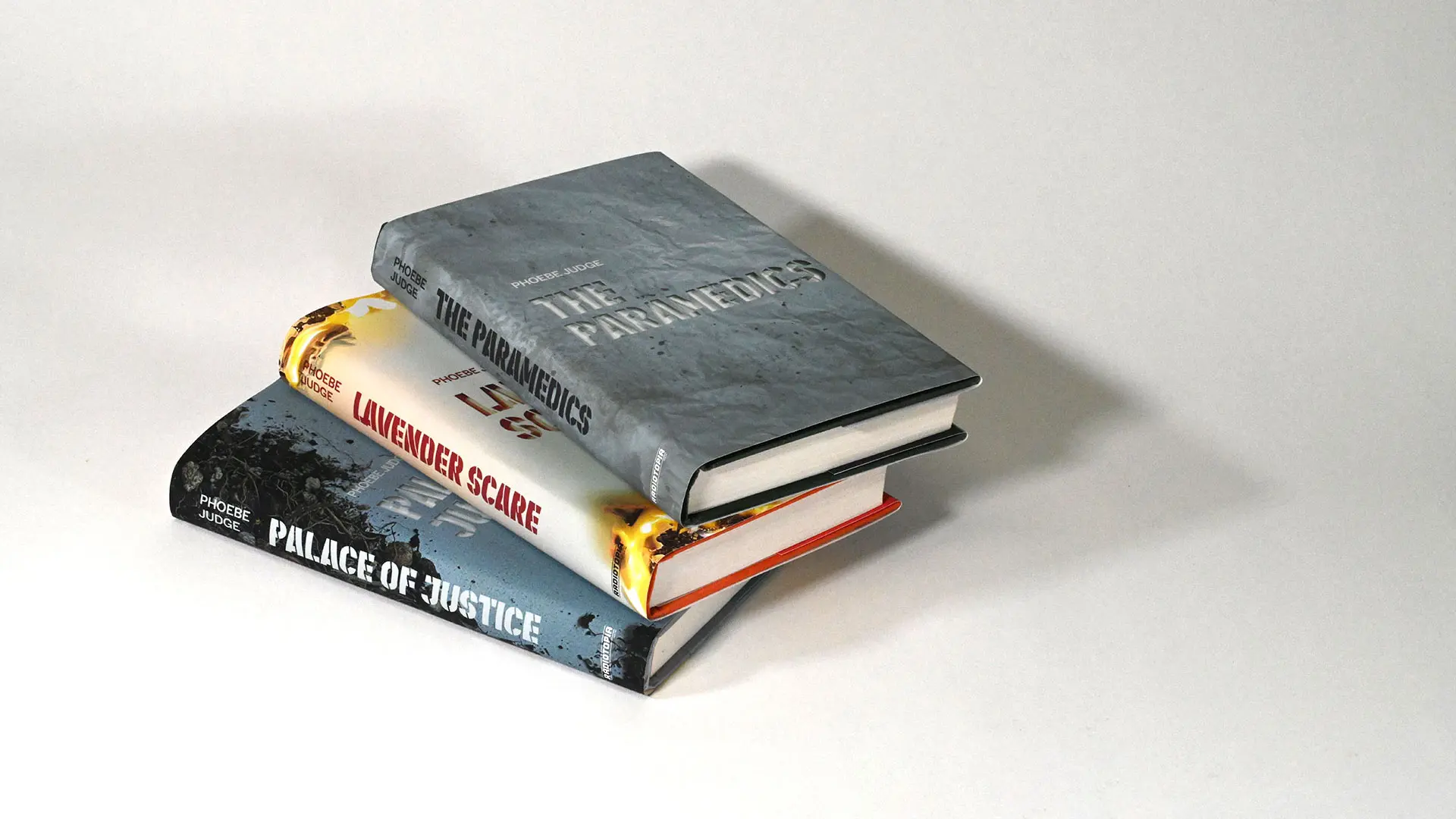 Stacked three books from the criminal spin-off publication.
